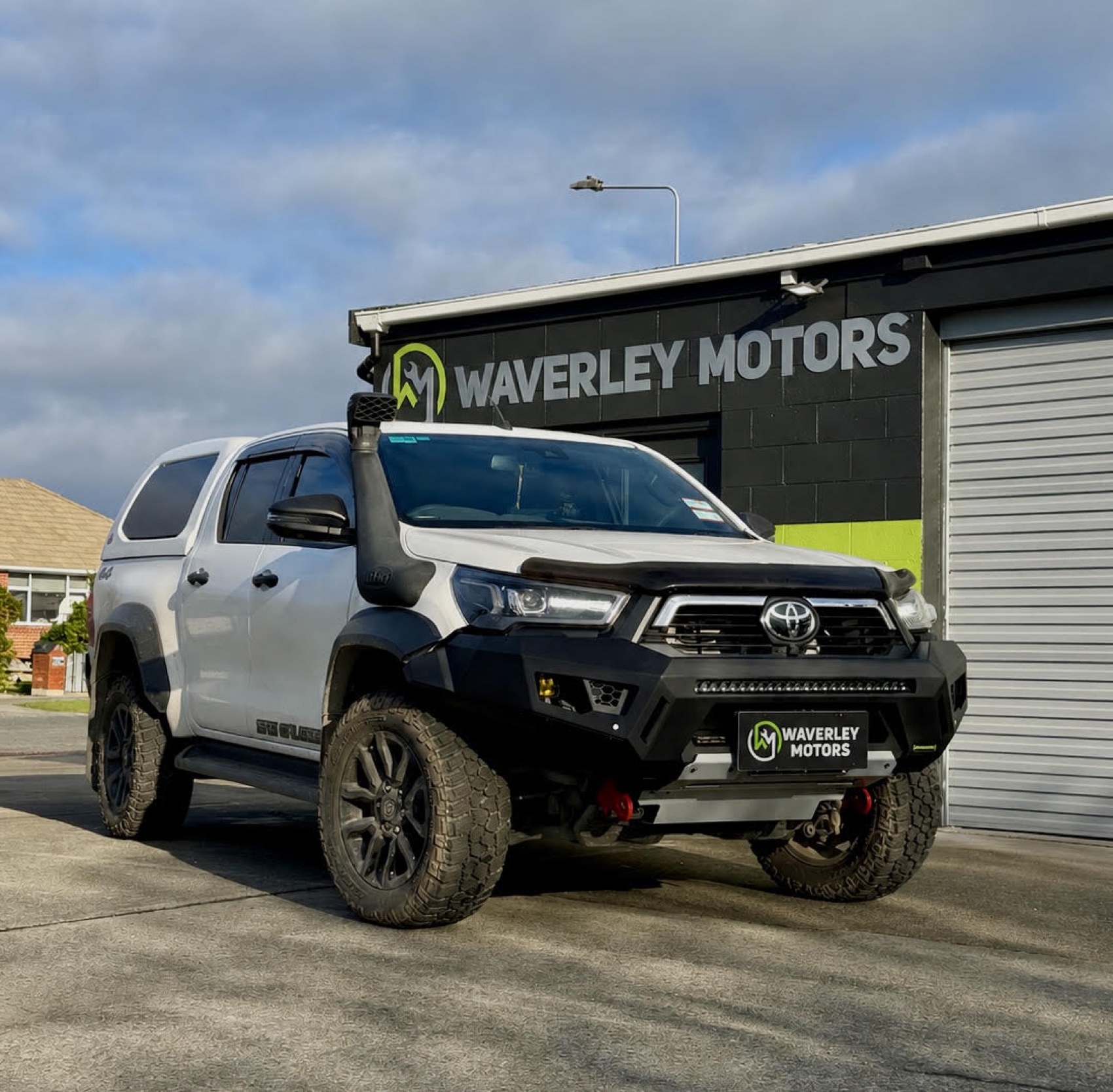 Lifted Toyota Hilux 4WD outside Waverley Motors