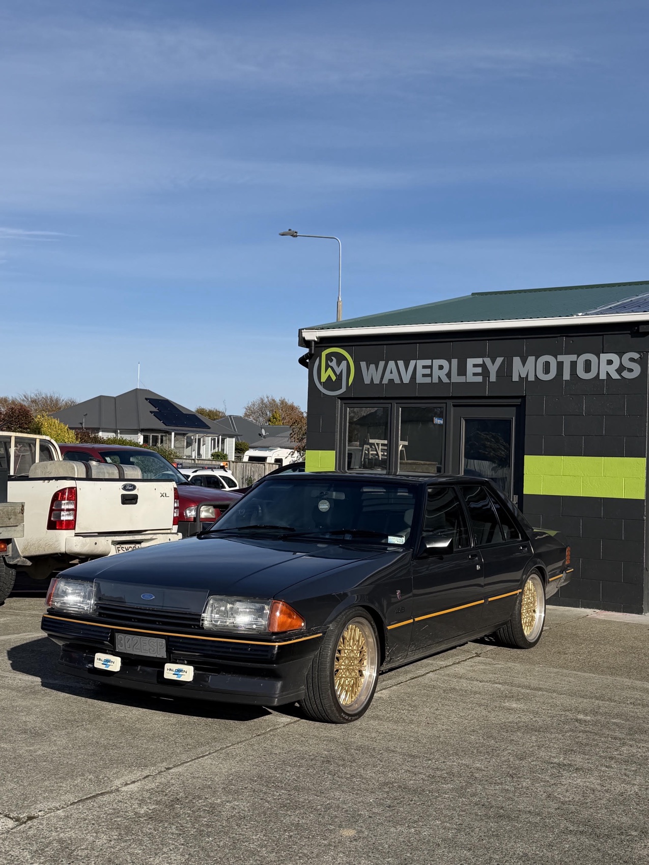 Classic Ford sedan outside the Waverley Motors workshop